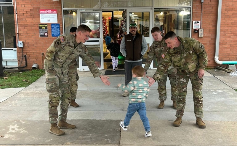 National Guard members greet students
