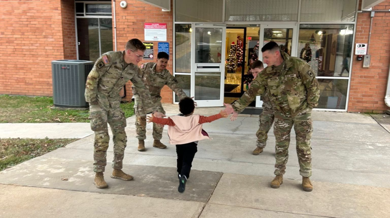 National Guard members greet students