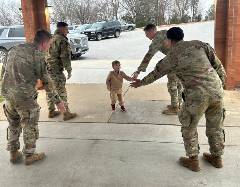 National Guard members greet students