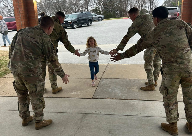 National Guard members greet students
