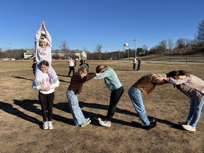 Students forming the number 100