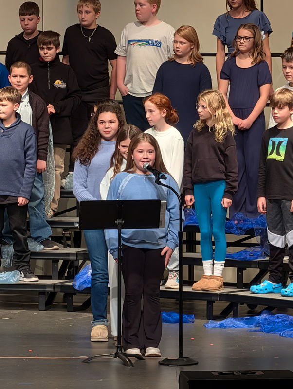 students performing on stage