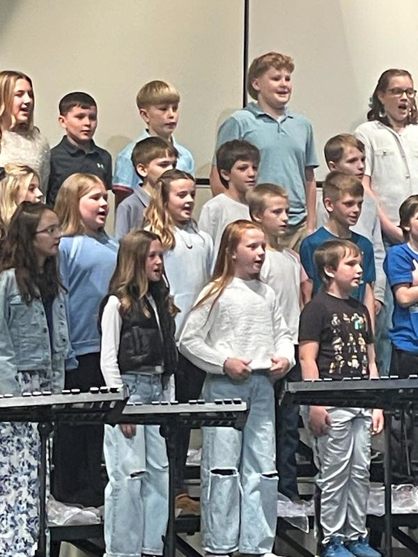 students performing on stage