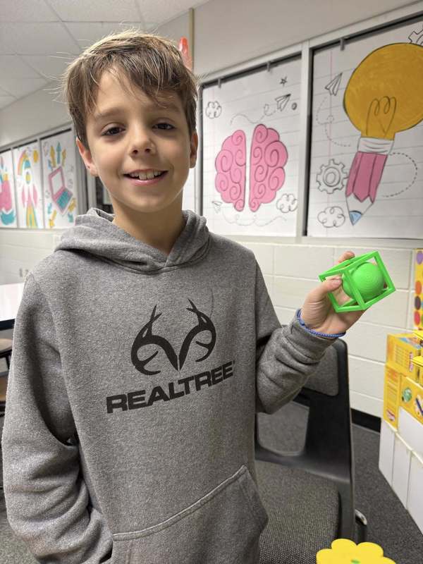 student with printed product