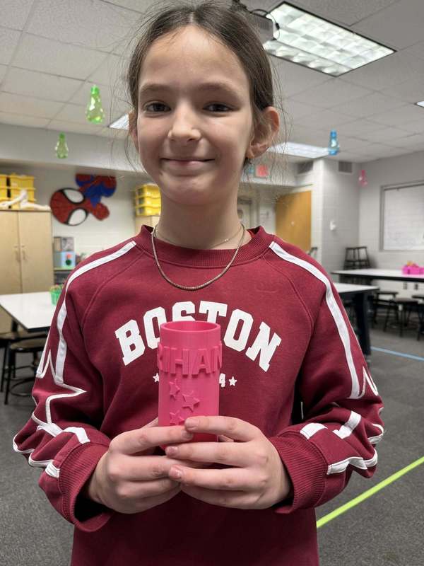 student with printed product