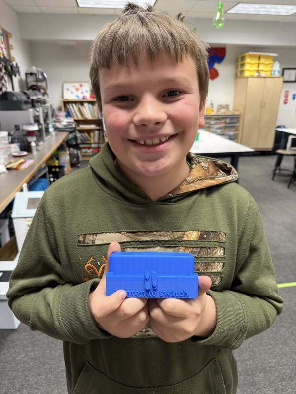 student with printed product