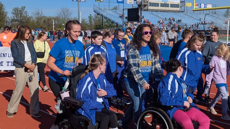 Special Olympians walking track