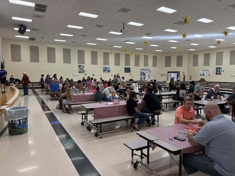 Patrons enjoying Bug Bistro in cafeteria