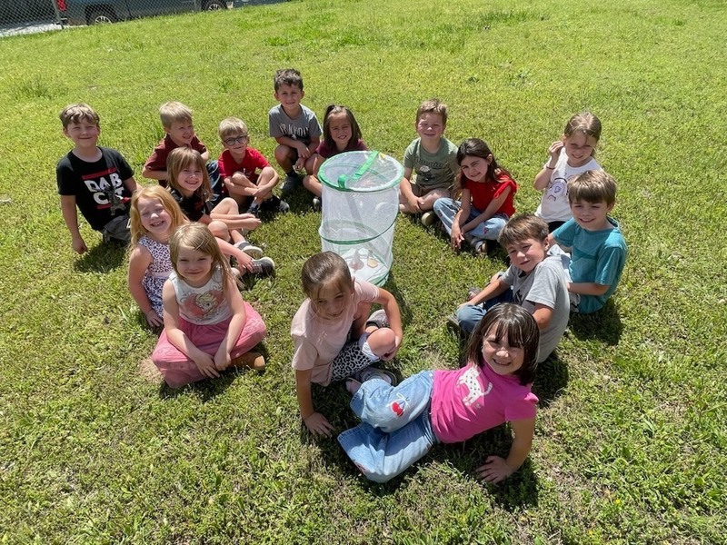 students outside with butterflies