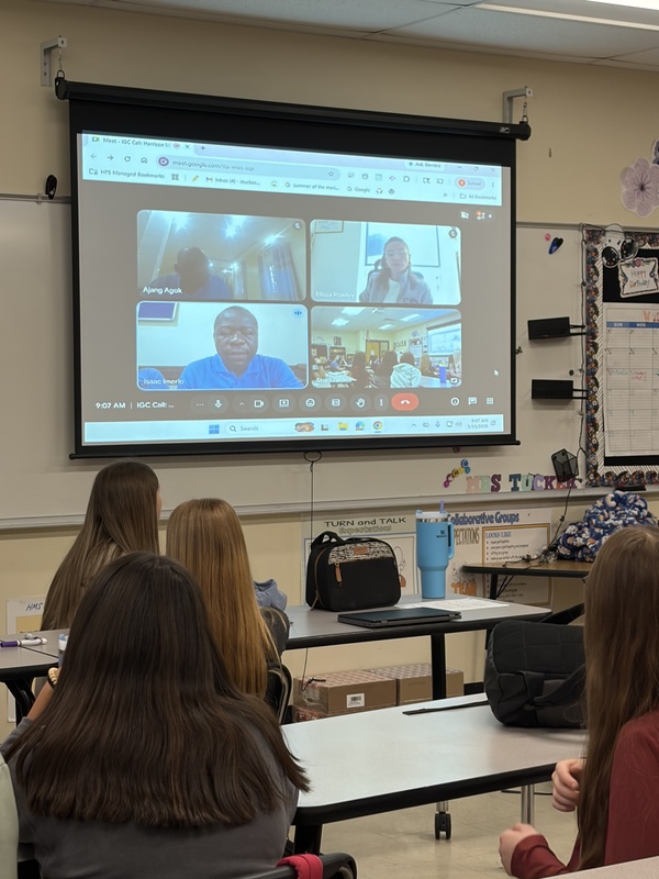 Student in classroom in Zoom meeting with water well team 