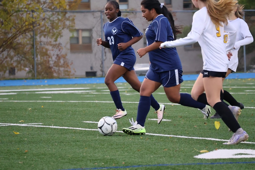 Hartford Public High School Owls Girls Soccer take the ball from Ellington