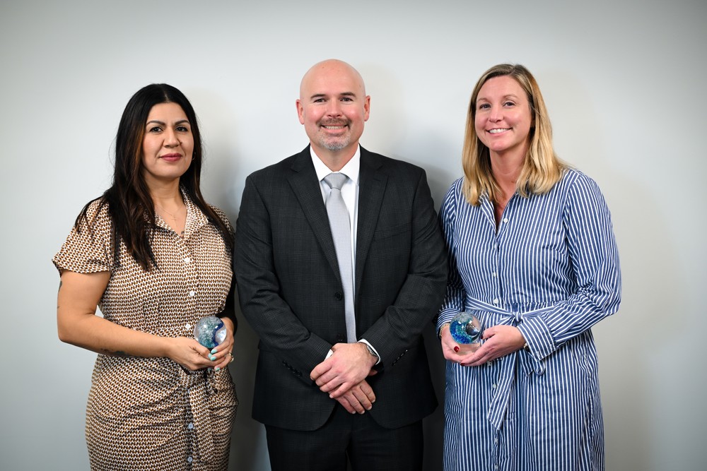 superintendent nick blackmer with nora and lindsay and their awards