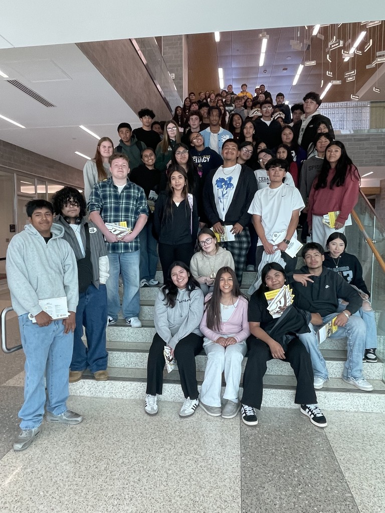 A GROUP OF HARTFORD HIGH SCHOOL STUDENTS POSE IN A STAIRWELL AT WESTERN MICHIGAN UNIVERSITY