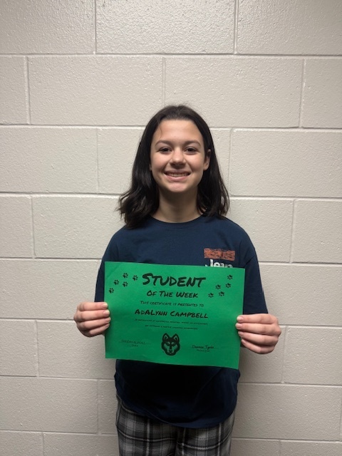 a. campbell holding her student  of the week sign
