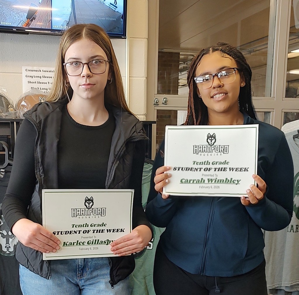 HHS students with their student of the week awards