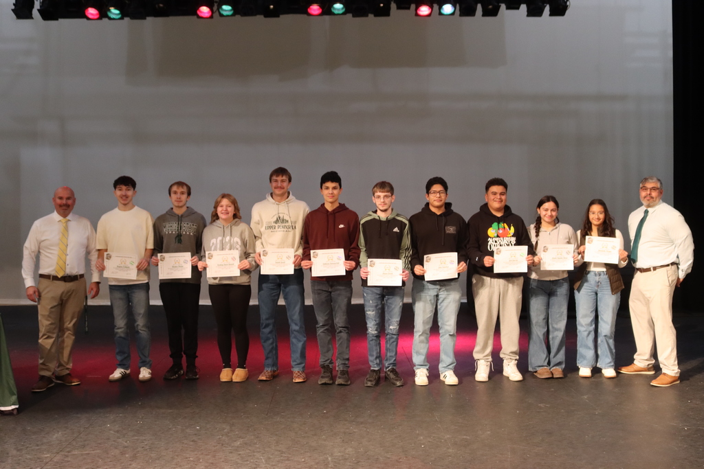 the senior top 10 post on stage with Superintendent Blackmer and Principal Robles