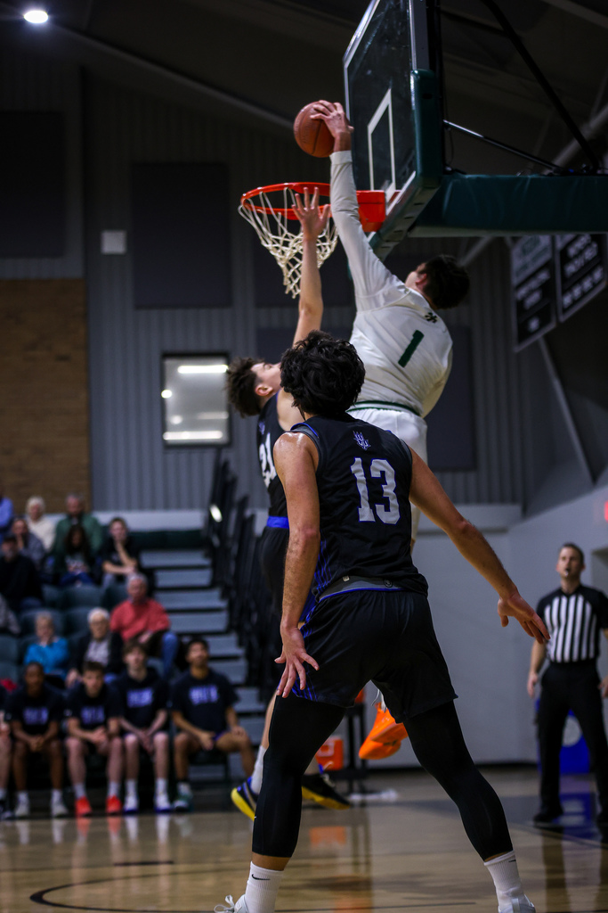 kaden johnson dunking a ball over a defender