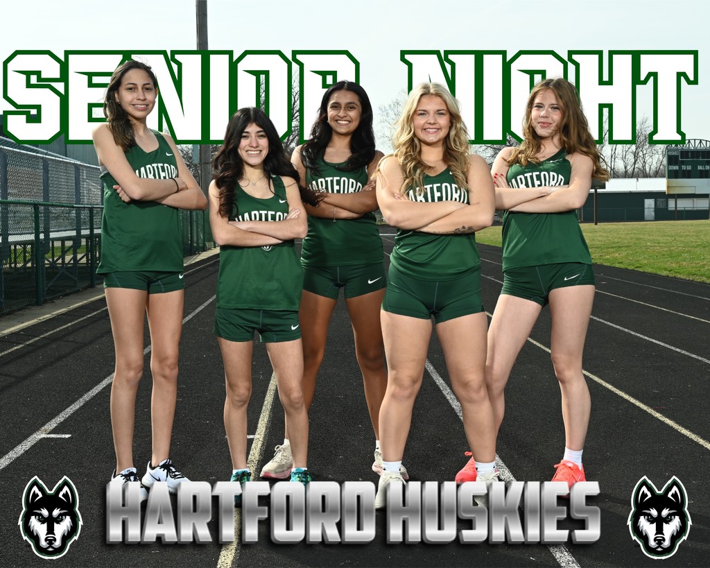 Hartford Huskies girls track seniors standing on the track in green uniforms with “Senior Night” and Hartford Huskies graphics.