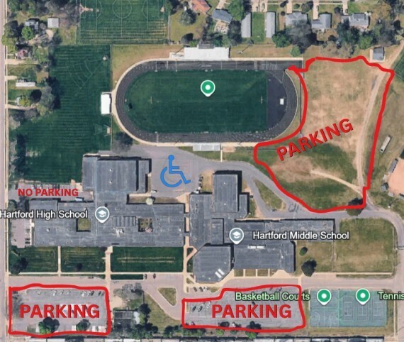 A satellite map of the Hartford High School and Hartford Middle School campus with designated graduation parking areas outlined in red. Parking is available in a large grass lot near the track on the east side of campus, in a southwest parking lot, and along the south side near the basketball courts. A “No Parking” area is marked near the front of Hartford High School. A blue handicap-accessible parking symbol is shown near the main entrance area.