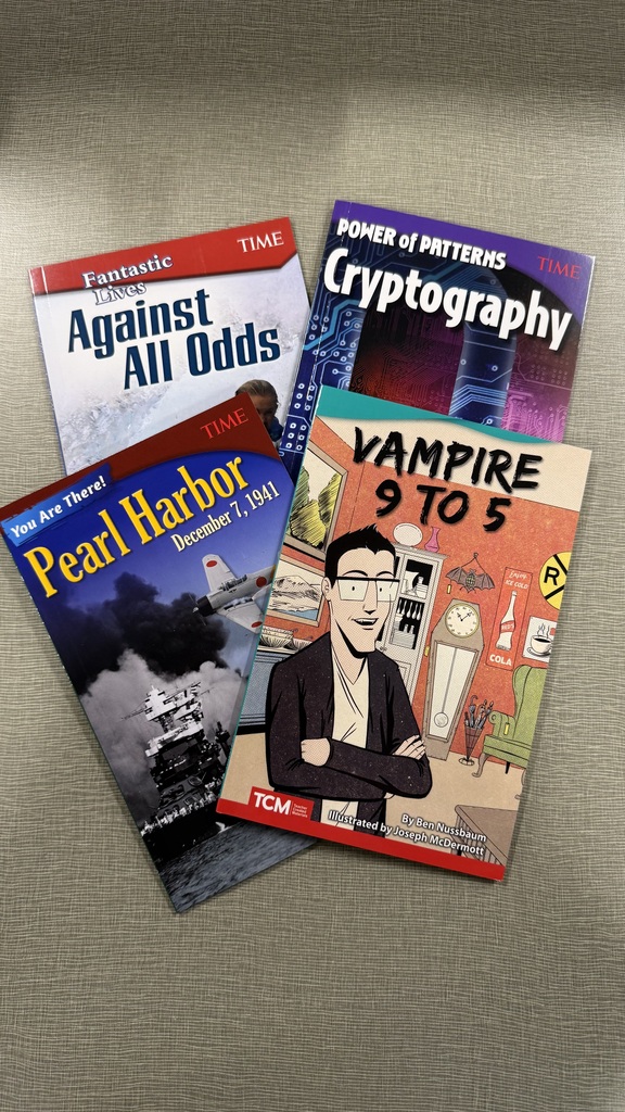 Five educational books and guides displayed on a gray textured surface, including titles about cryptography, Pearl Harbor, overcoming adversity, vampires, and high school readiness.