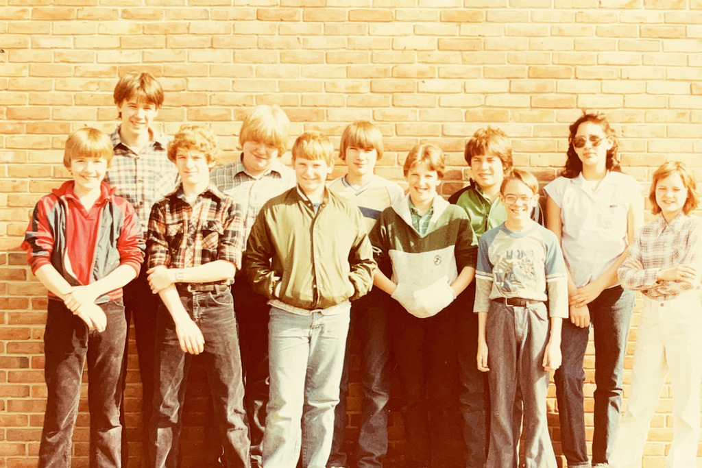 A collection of vintage Hartford Public Schools photographs featured in Hartford Rewind | Volume 2. The images include students posing with academic trophies, science classroom activities, elementary students reading and participating in class, hands-on classroom projects, cultural learning activities, CPR training, group class photos, Adult Education displays at a community event, students gathered outdoors, and various classroom and school life scenes from past decades. The photographs capture everyday moments, learning experiences, and student life throughout Hartford Public Schools' history.