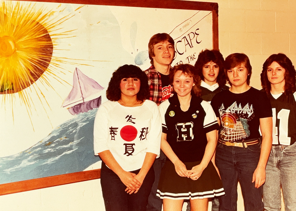 A collection of vintage Hartford Public Schools photographs featured in Hartford Rewind | Volume 2. The images include students posing with academic trophies, science classroom activities, elementary students reading and participating in class, hands-on classroom projects, cultural learning activities, CPR training, group class photos, Adult Education displays at a community event, students gathered outdoors, and various classroom and school life scenes from past decades. The photographs capture everyday moments, learning experiences, and student life throughout Hartford Public Schools' history.