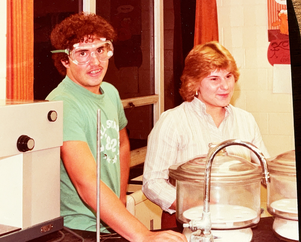 A collection of vintage Hartford Public Schools photographs featured in Hartford Rewind | Volume 2. The images include students posing with academic trophies, science classroom activities, elementary students reading and participating in class, hands-on classroom projects, cultural learning activities, CPR training, group class photos, Adult Education displays at a community event, students gathered outdoors, and various classroom and school life scenes from past decades. The photographs capture everyday moments, learning experiences, and student life throughout Hartford Public Schools' history.