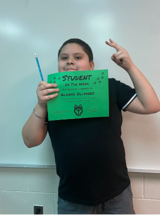 Alonso Olivarez with his student of the week award