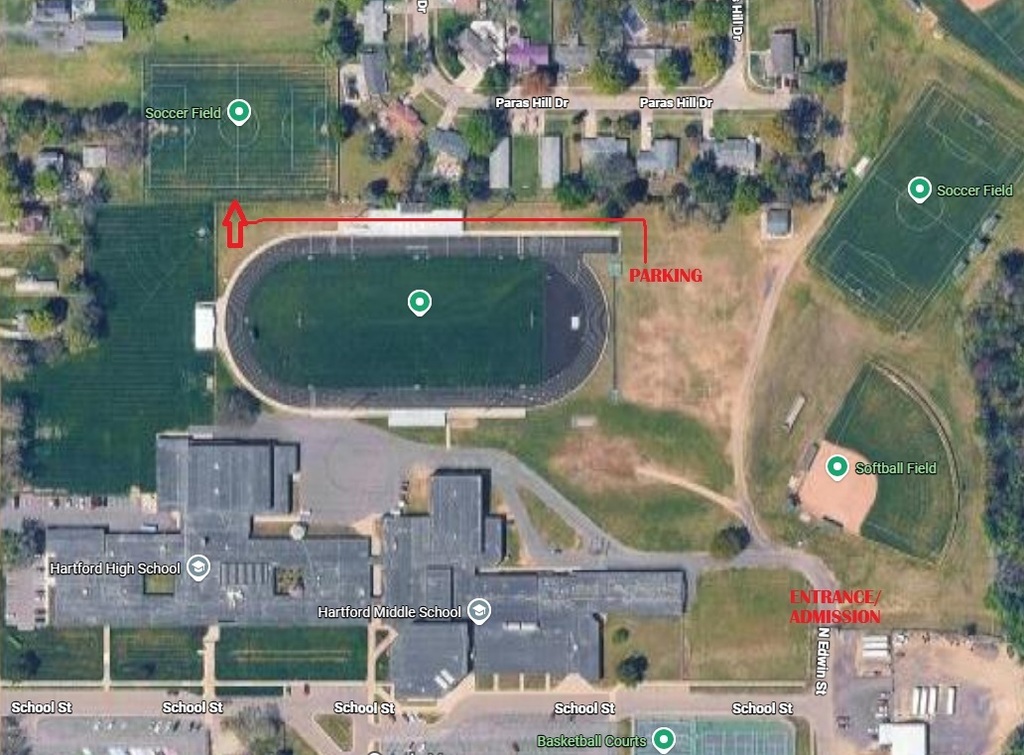 Aerial map of the Hartford High School and Hartford Middle School athletic complex showing directions for a soccer game. The entrance/admission area is marked off N. Edwin Street on the southeast side of campus. A red route leads north and then west along the north side of the football field to the designated parking area, with an arrow pointing toward the soccer field northwest of the football field.
