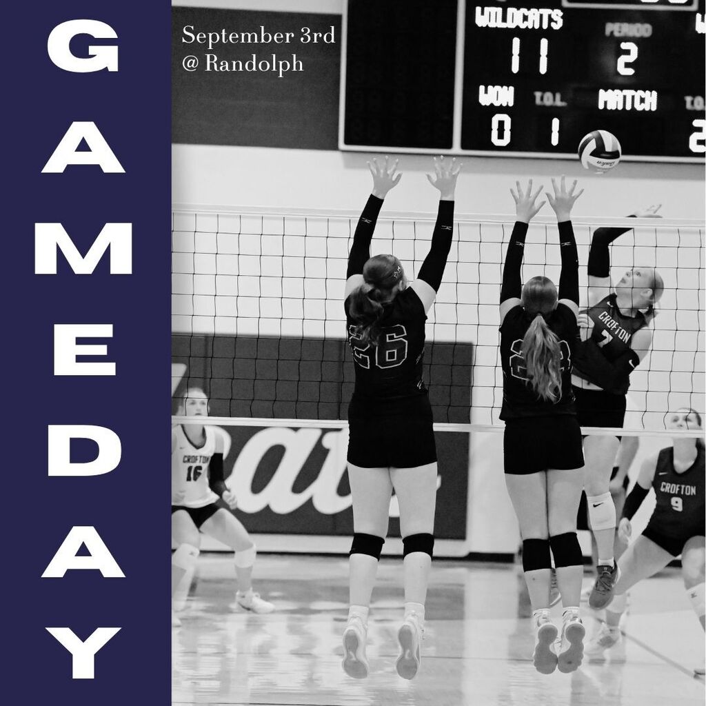 Black-and-white “Game Day” volleyball graphic showing players leaping at the net to block a hit, with teammates and a scoreboard behind them.