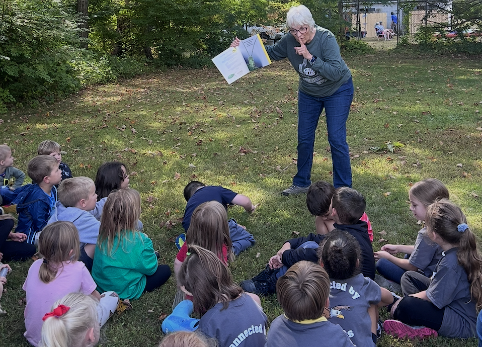 Students learning about community helps at River Day!