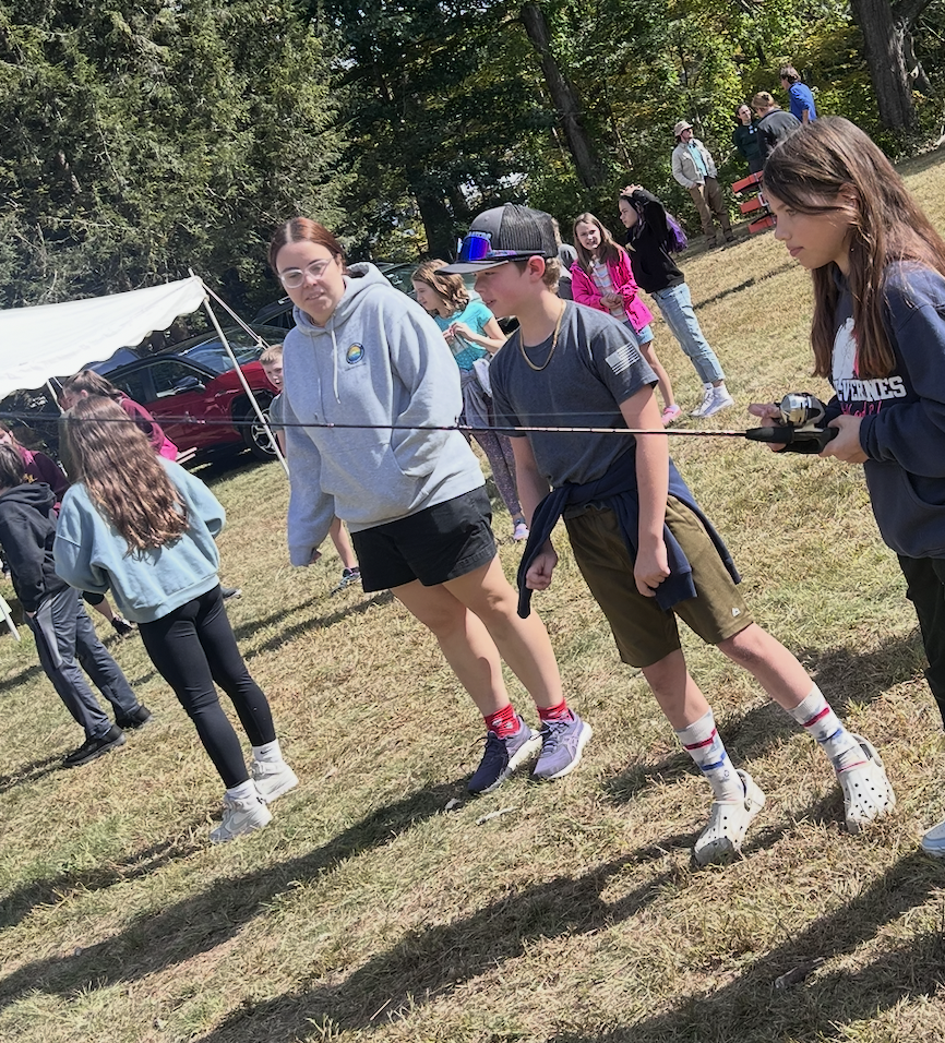 students learning how to fly fish