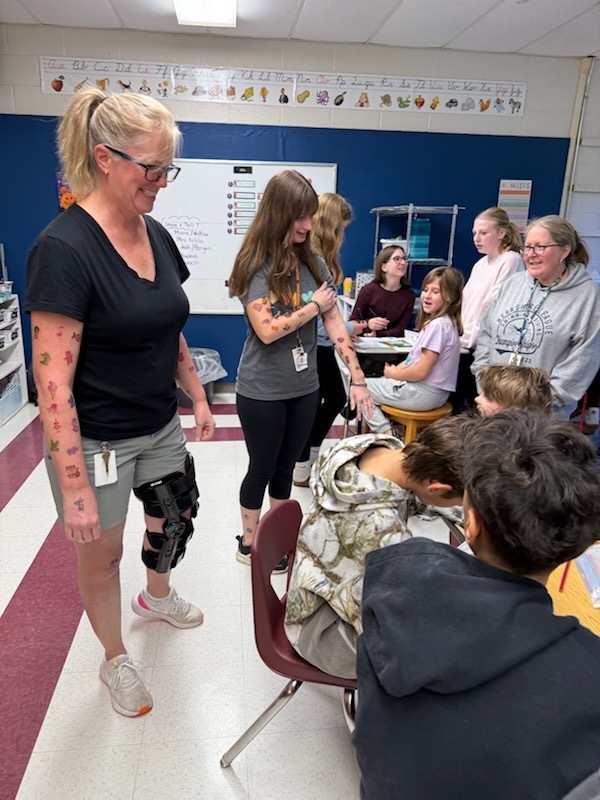 Teachers and class of kids