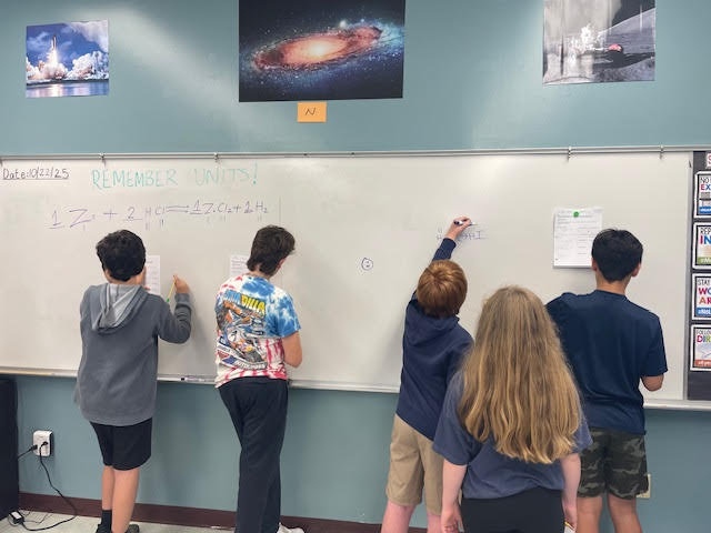 Students at whiteboard.