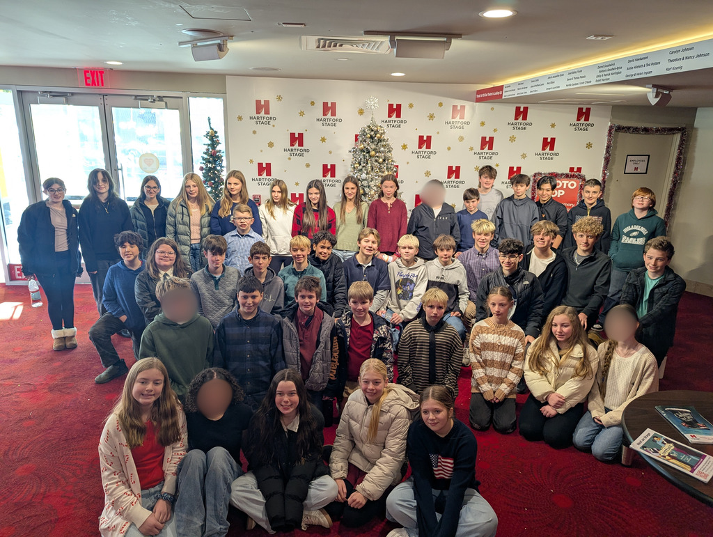 Group of students in front of Hartford Stage backdrop,