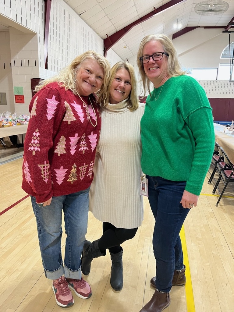 Three teachers in festive dress
