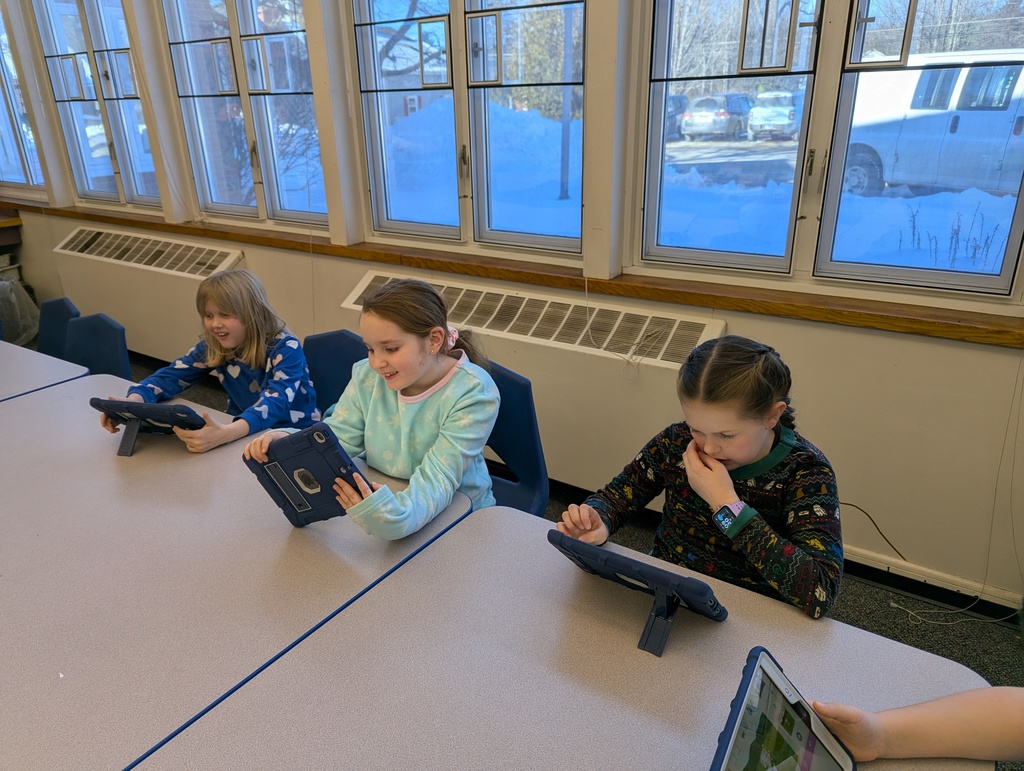 kids looking at ipads