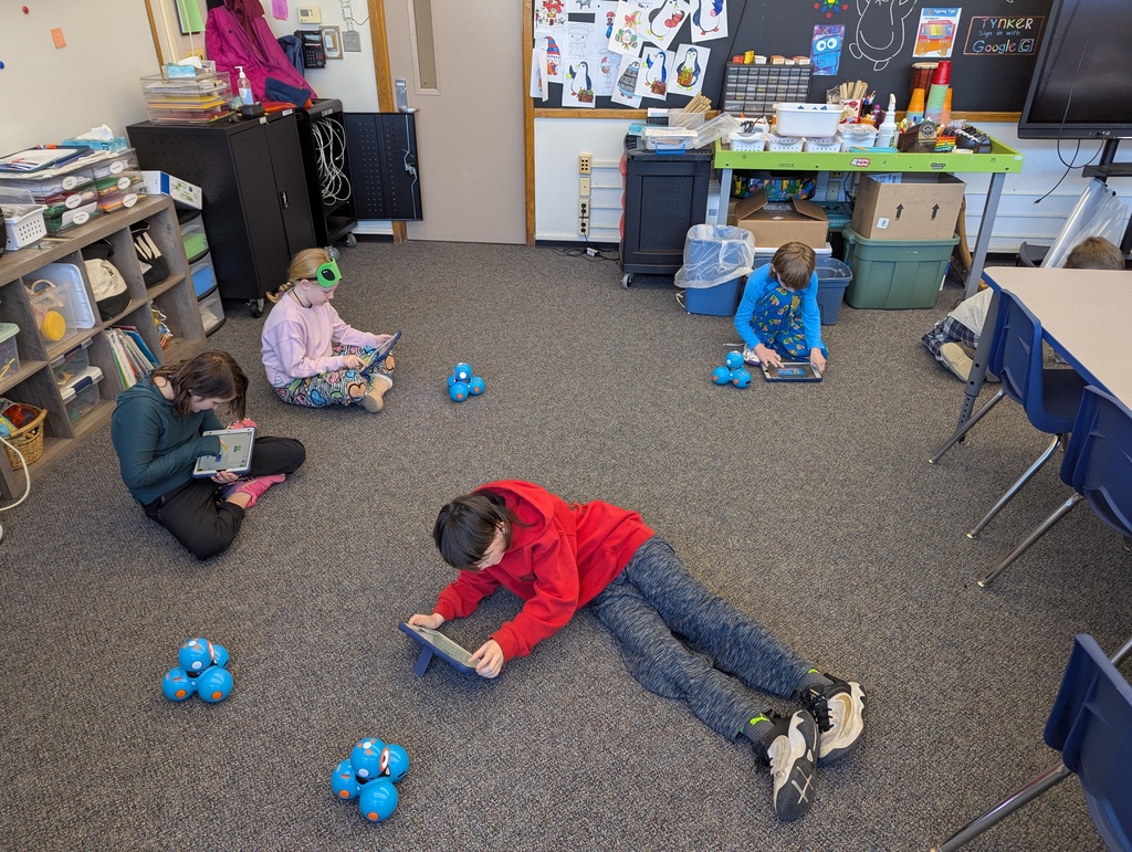 kids on floor with robots