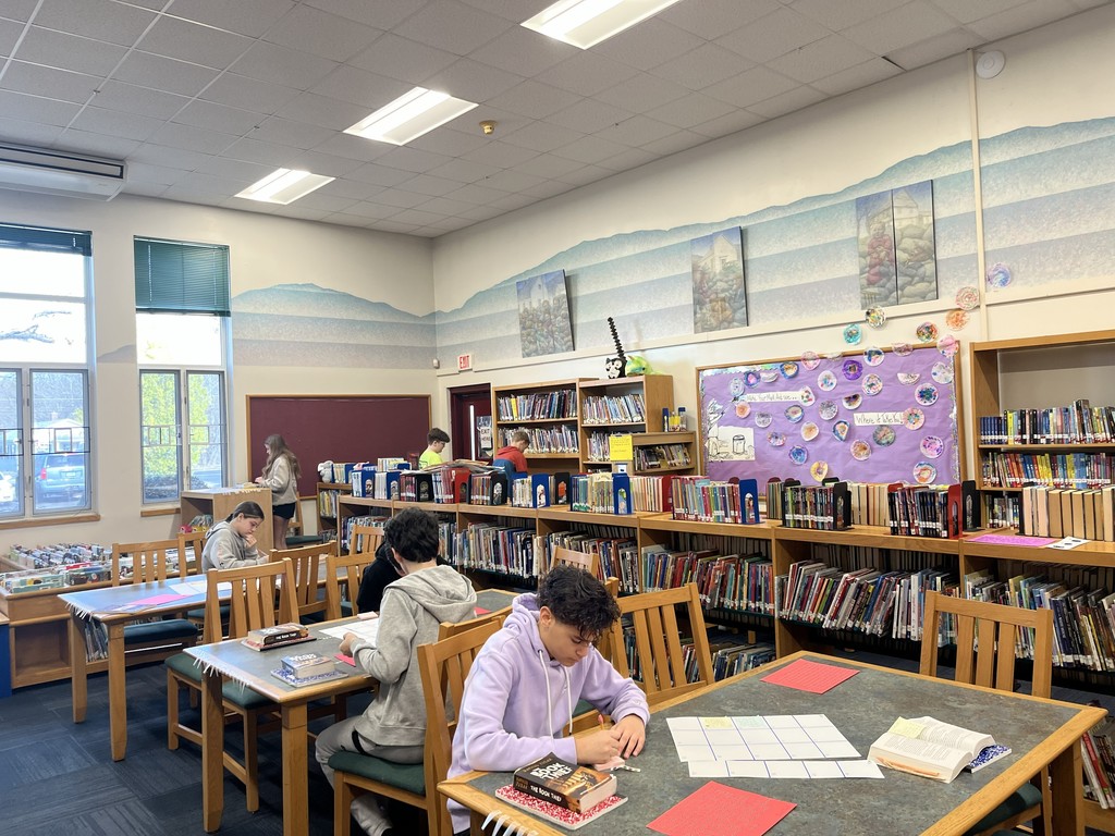 students at library table