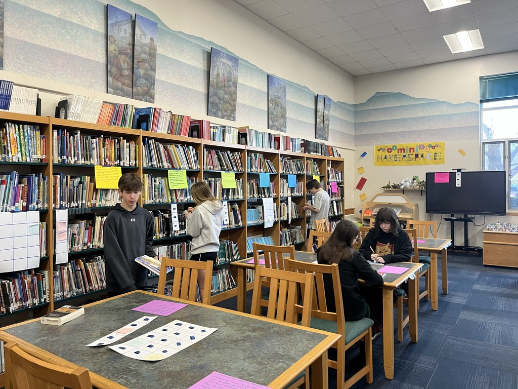 students walking around library