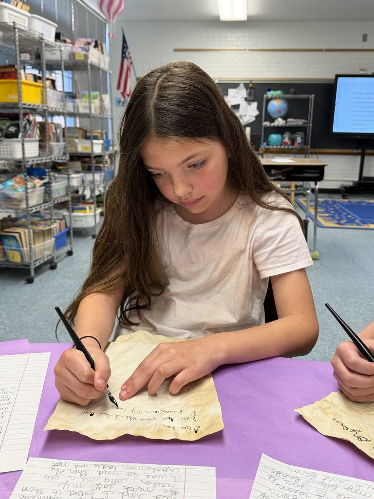 Girl writing at desk