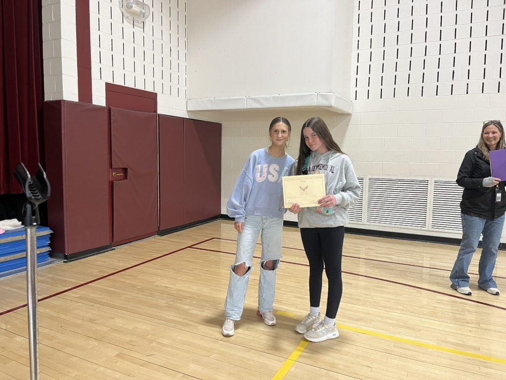 Girls holding certificate