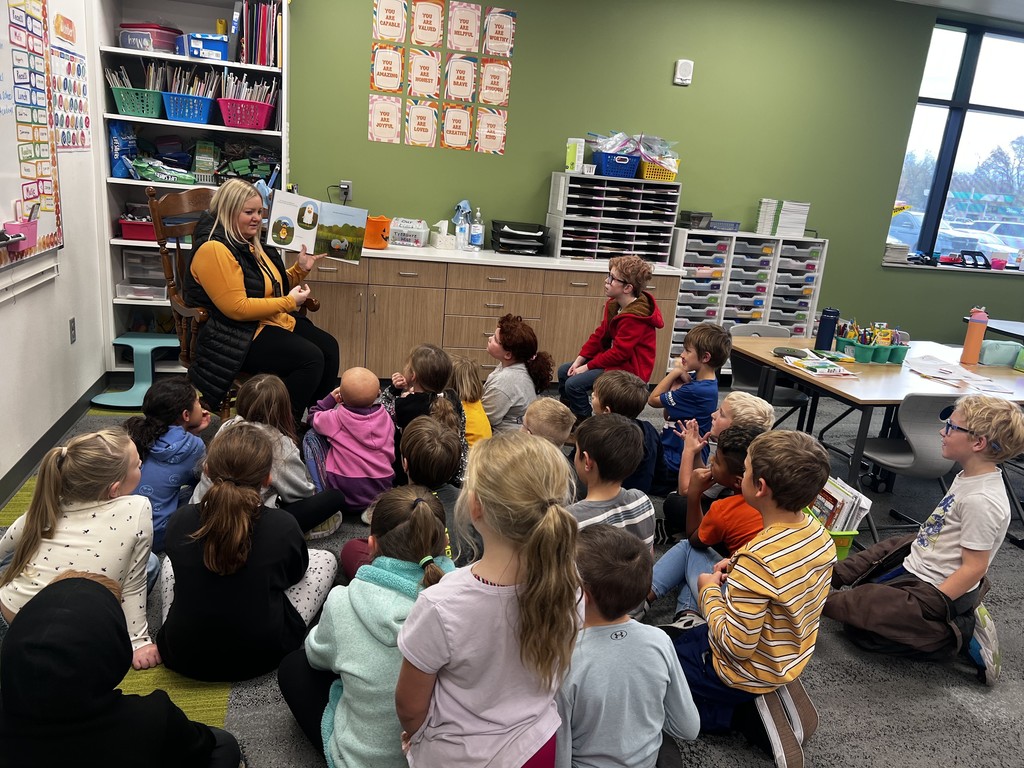 Mrs. Benz reading to 2nd grade students