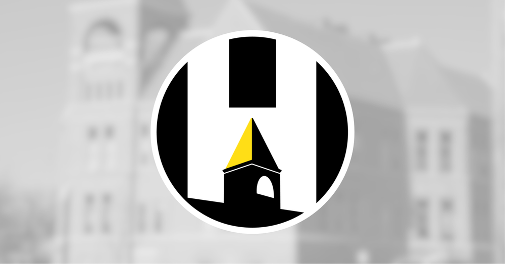 Harvard CUSD 50 logo over a blurred photo fo the Central Office building