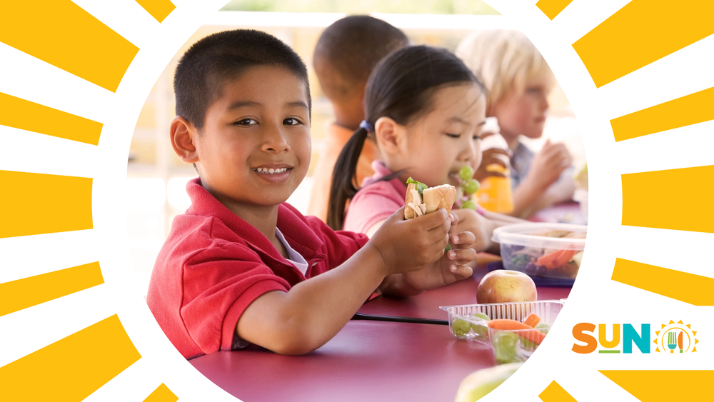 Smiling child with sandwich