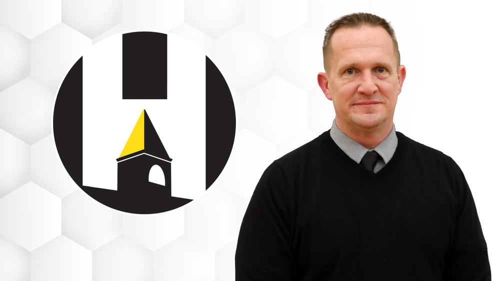 Chris Rozanski with CUSD 50 logo