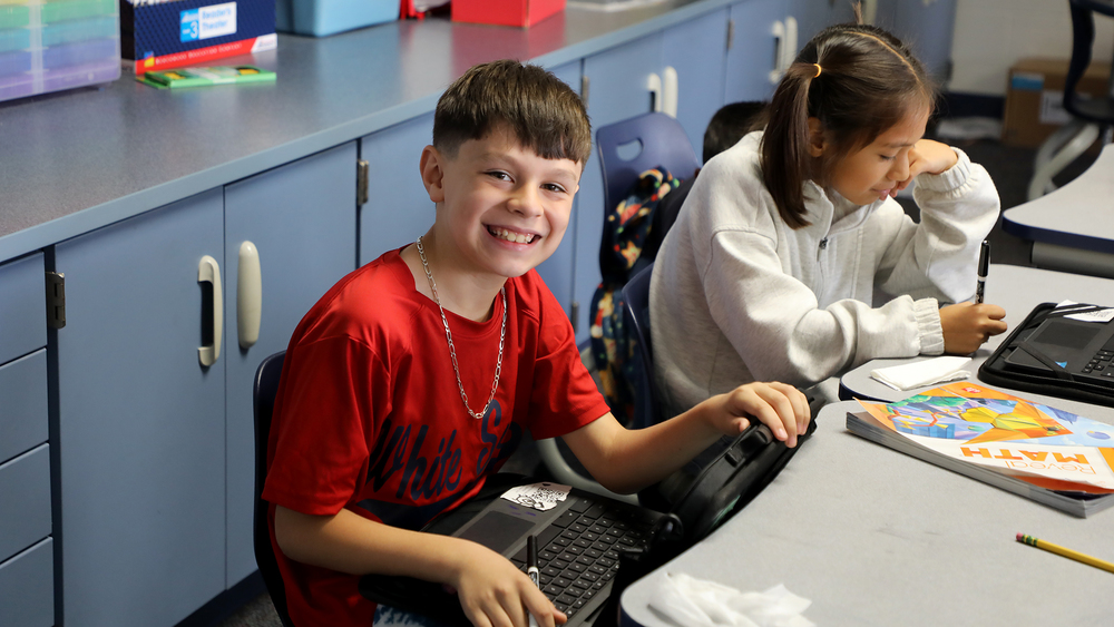 Smiling student at computer