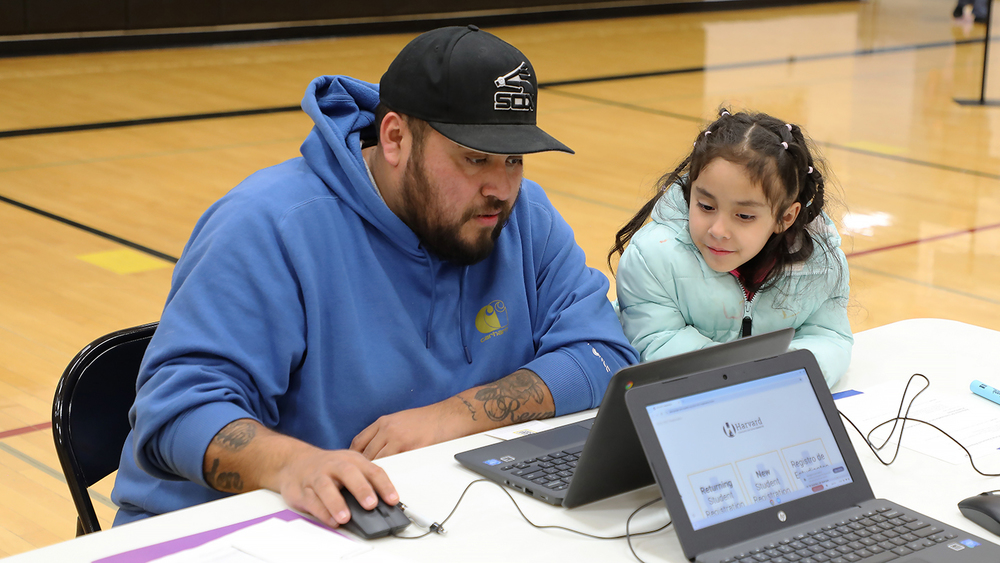 Parent and child at registration event