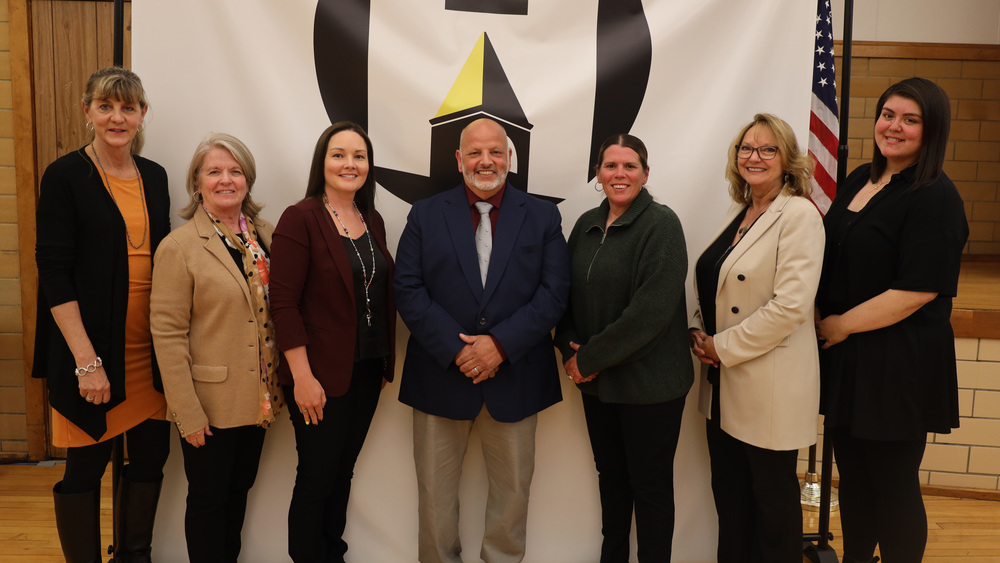 School board members standing in a line