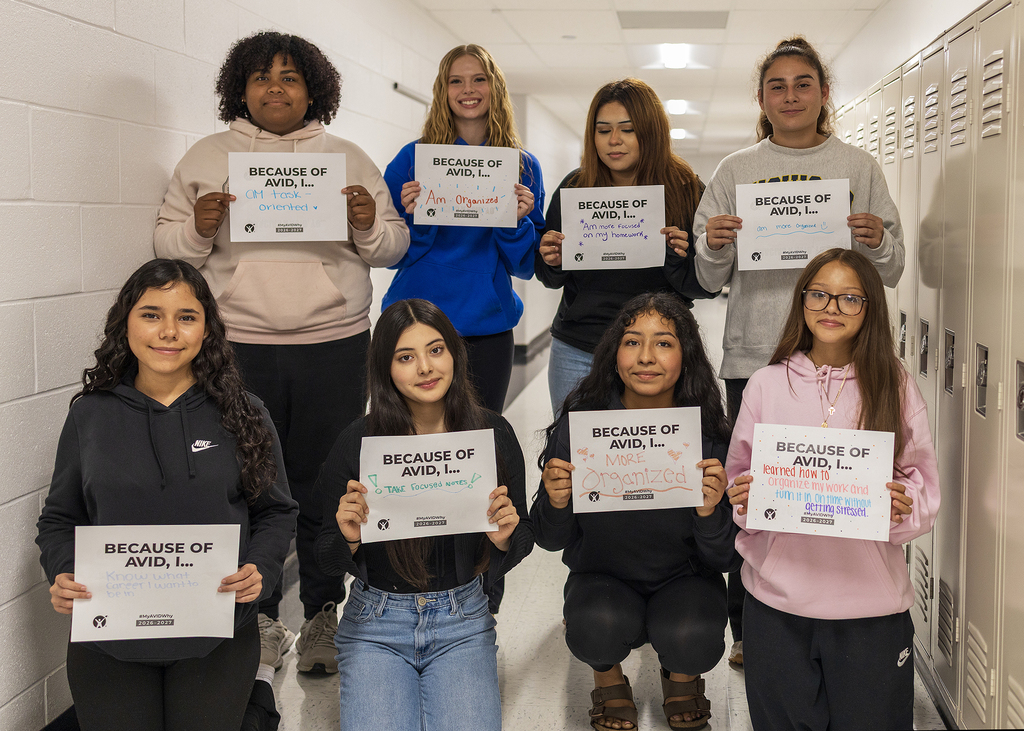 Students in hallway with AVID sign.